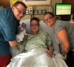 Tamara with couple and baby in hospital